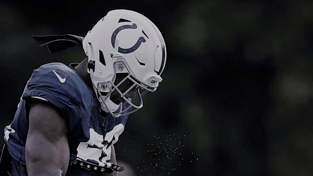 Bobby Okereke focused in Indianapolis Colts uniform during intense football game action wallpaper