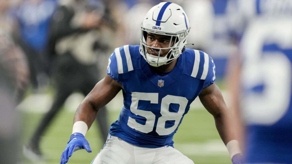 Bobby Okereke intense game action focused in Indianapolis Colts uniform on football field wallpaper