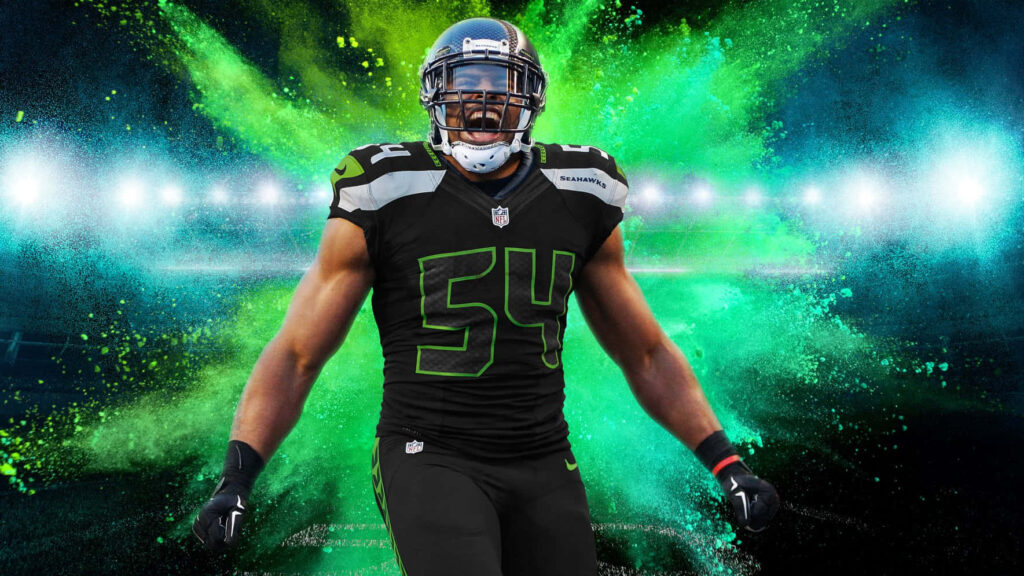 Bobby Wagner in dynamic football pose with vibrant green and blue light burst wallpaper background
