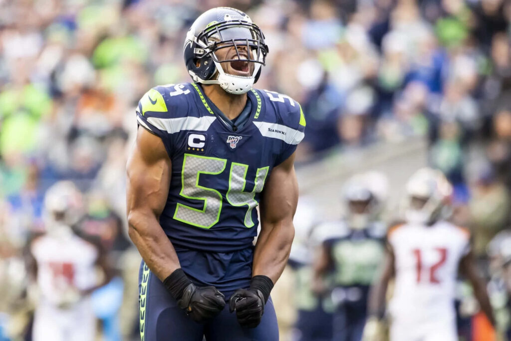 Bobby Wagner Seattle Seahawks intense moment leadership energy on field football wallpaper background