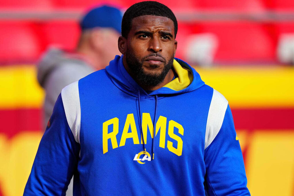 Bobby Wagner in blue Los Angeles Rams hoodie focused on field perfect Rams linebacker wallpaper