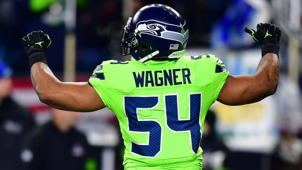 Bobby Wagner celebrating in Seattle Seahawks uniform vibrant energetic game day wallpaper background