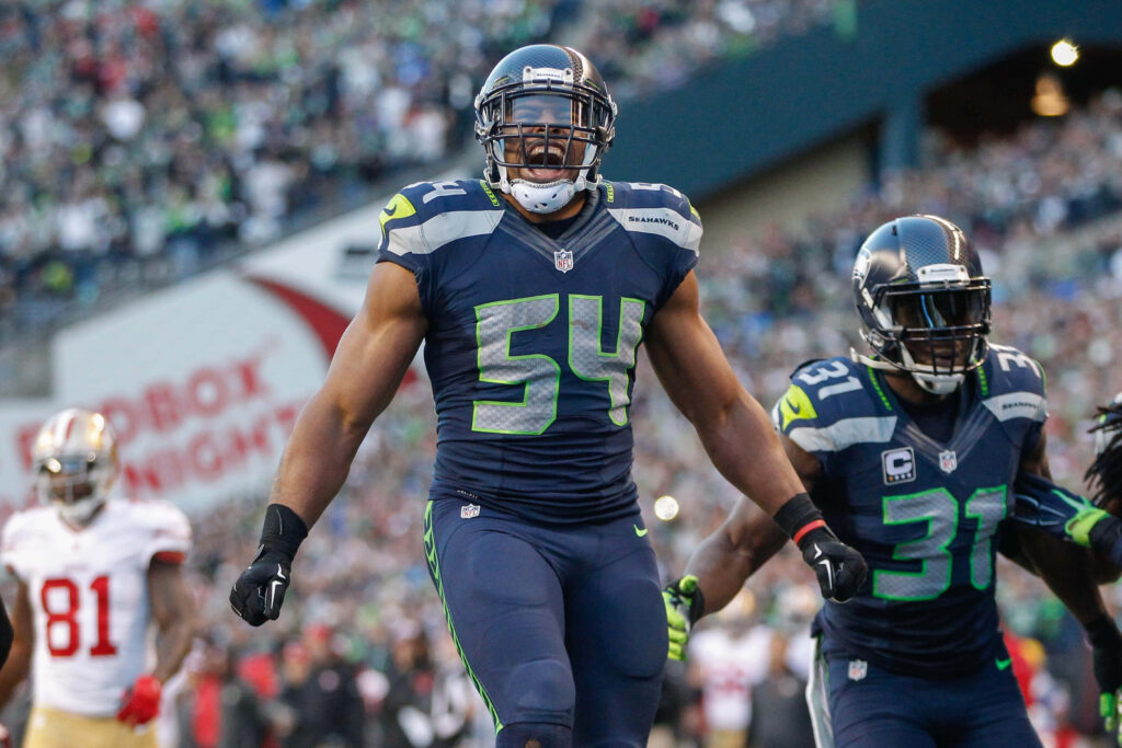 Bobby Wagner intense celebration on field in Seattle Seahawks uniform during NFL game wallpaper