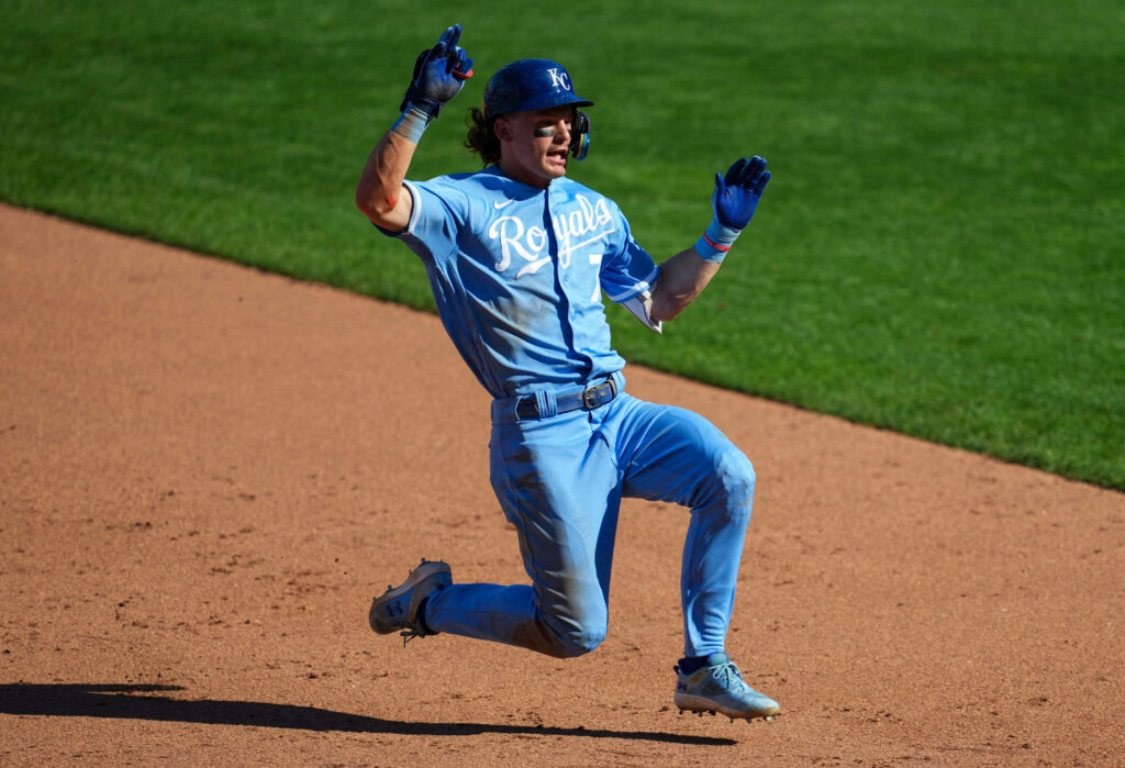 Bobby Witt Jr. celebrating an exciting baseball moment vibrant game action wallpaper background