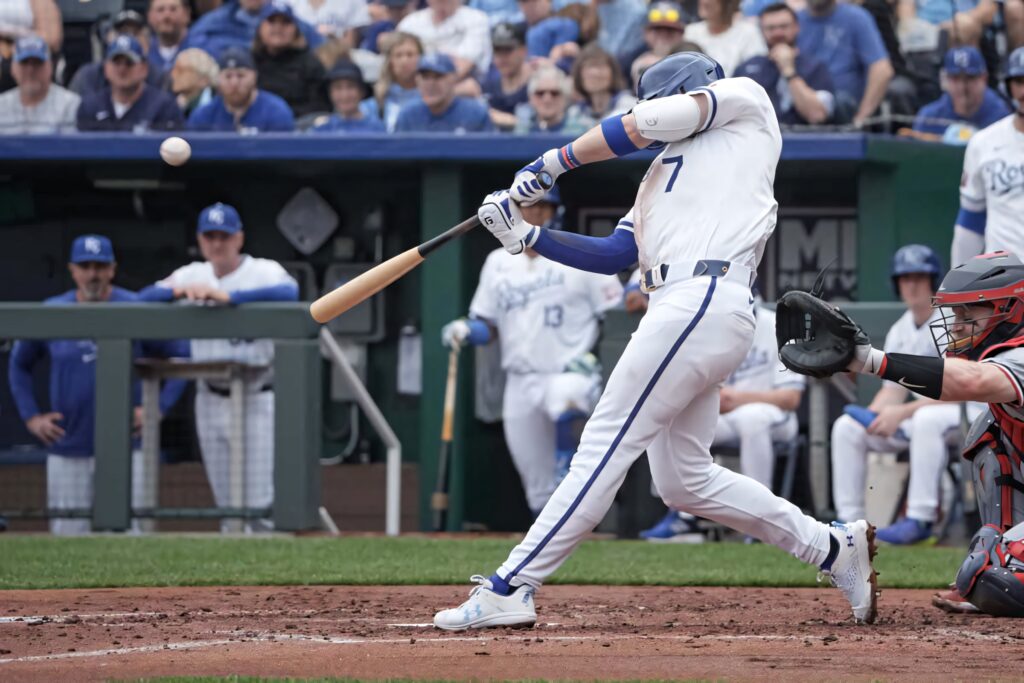 Bobby Witt Jr swinging powerful bat in intense baseball game dynamic sports wallpaper background