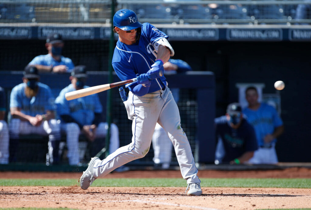 Bobby Witt Jr swinging bat in Kansas City Royals uniform dynamic baseball action wallpaper