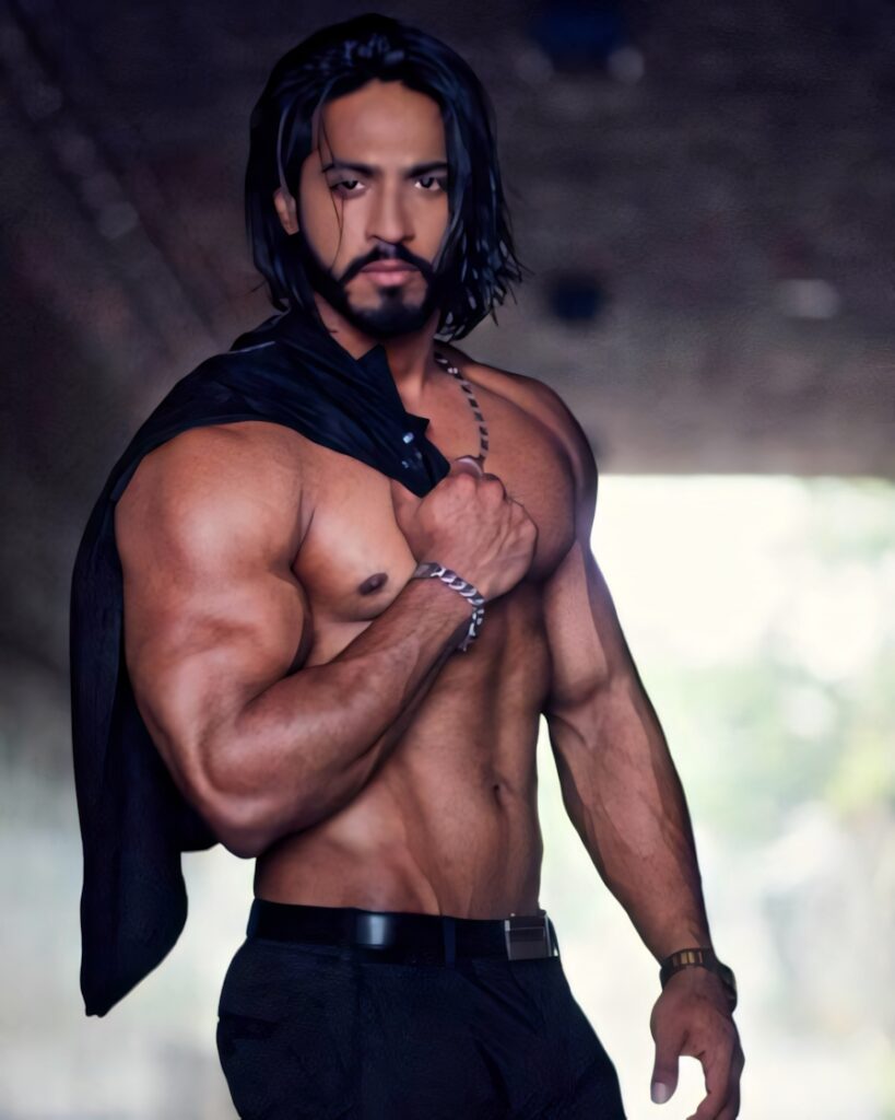 Bodybuilder Thakur showcasing muscular physique and strength in confident athletic pose wallpaper
