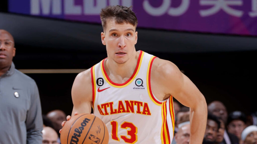 Bogdan Bogdanovic dribbling basketball focused Atlanta Hawks dynamic court wallpaper background