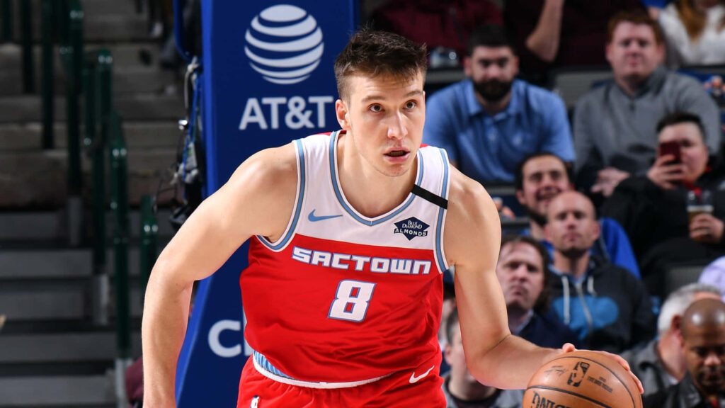 Bogdan Bogdanović Sacramento Kings in red white uniform playing basketball court wallpaper background