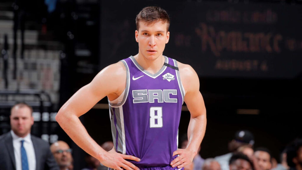 Bogdan Bogdanović in Sacramento Kings uniform poised on basketball court ready for action wallpaper