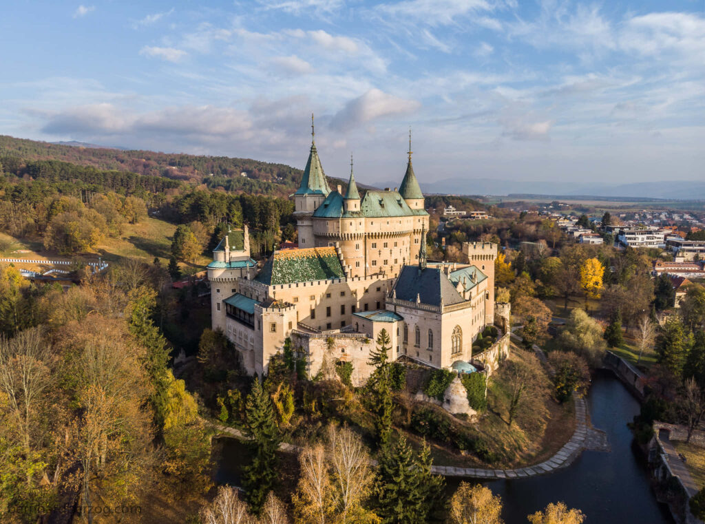 Bojnice Castle medieval architecture autumn trees river Slovakia scenic countryside wallpaper background