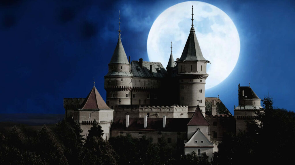 Bojnice Castle silhouette under full moon medieval Gothic turrets night sky wallpaper background