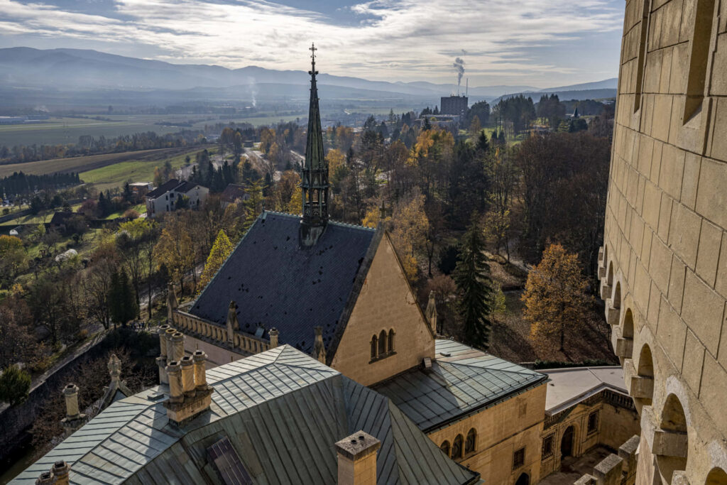Bojnice Castle Slovakia medieval architecture gothic spires stone walls autumn trees mountains Wallpaper