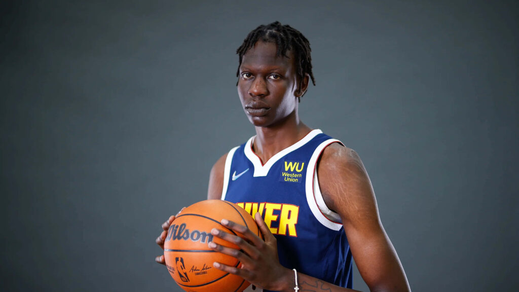 Bol Bol Denver jersey portrait with Wilson basketball on neutral gray high-resolution wallpaper