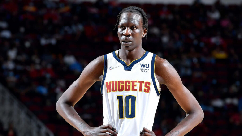Bol Bol Denver Nuggets wallpaper showing tall athlete on court with focused expression vibrant arena