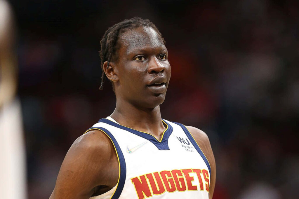 Bol Bol Denver Nuggets close-up portrait in official jersey with blurred arena background wallpaper