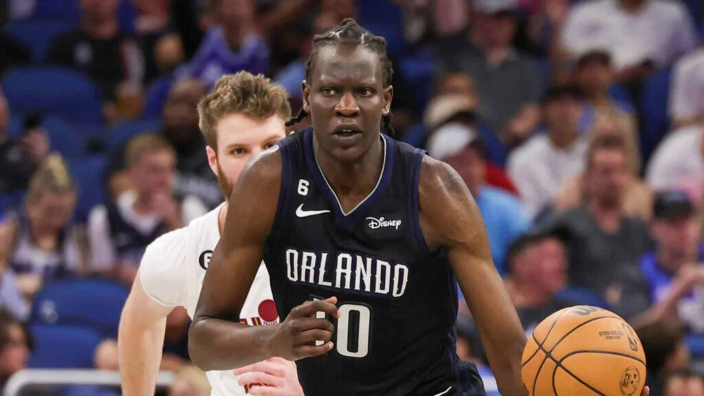 Bol Bol Orlando Magic action shot in black jersey showcasing athleticism on basketball court Wallpaper