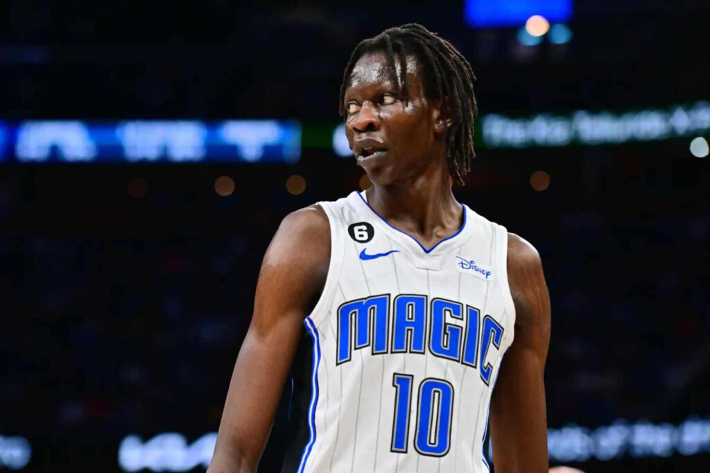 Bol Bol Orlando Magic basketball action wallpaper HD vibrant NBA court background fans
