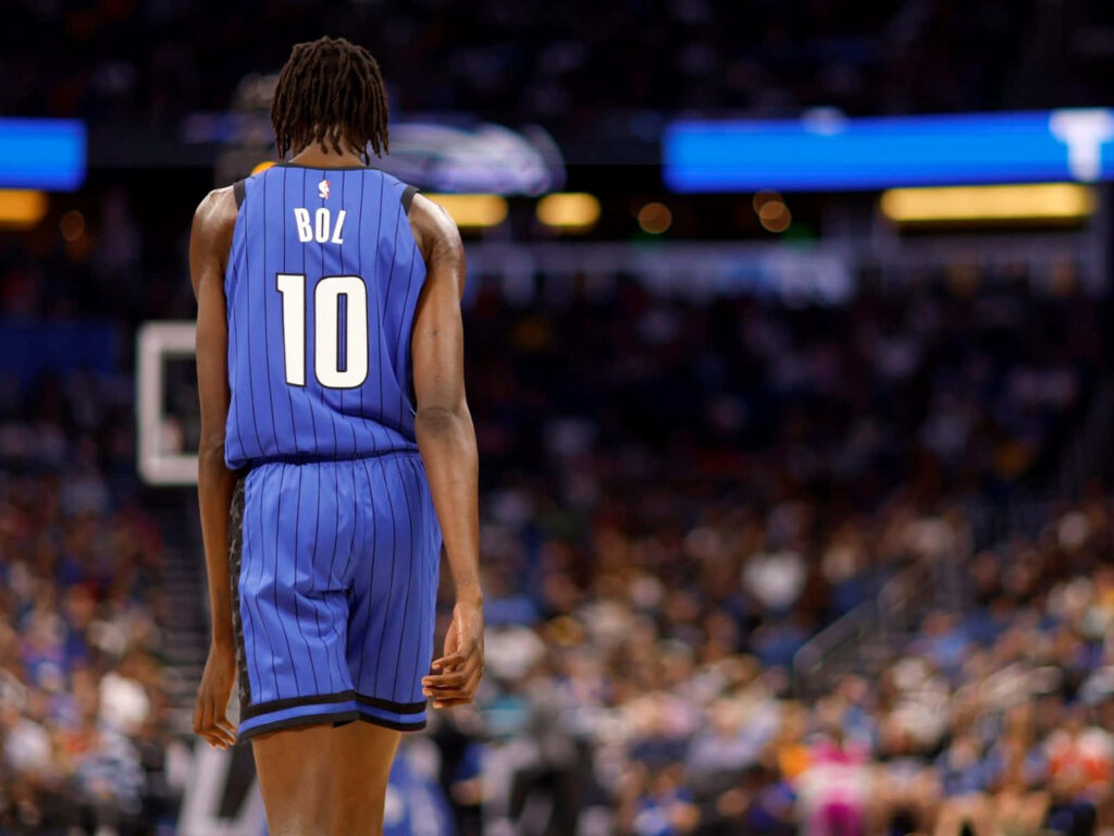 Bol Bol Orlando Magic jersey number 10 on court vibrant NBA game wallpaper background