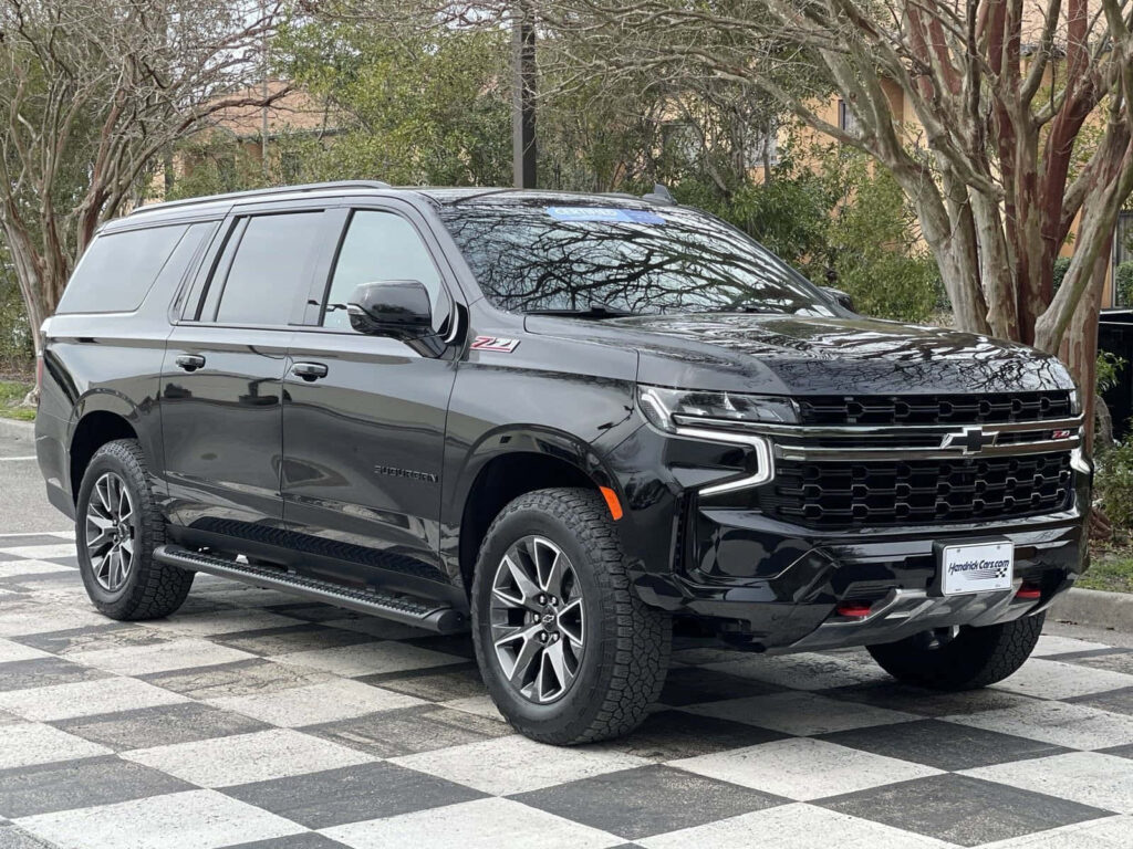 Stunning Black Chevrolet SUV Wallpaper on Checkered Pavement