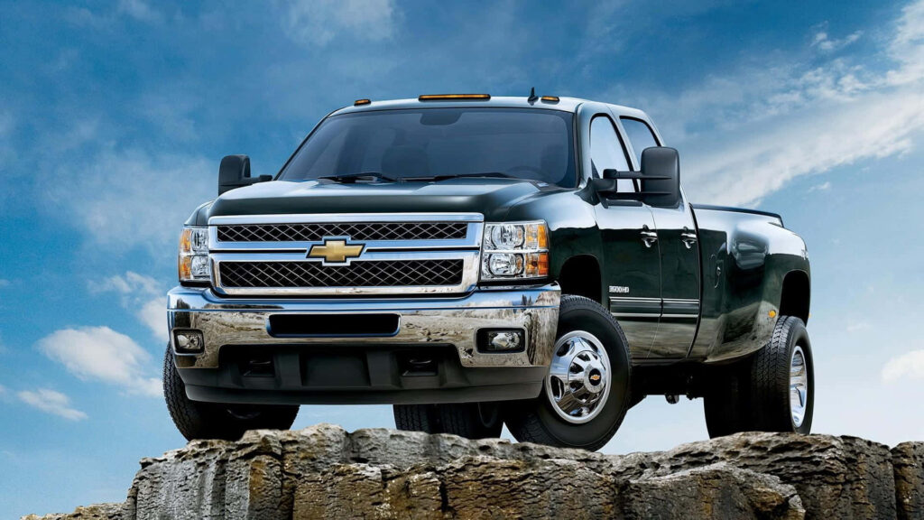 Bold Black Chevrolet Silverado Wallpaper Against Blue Sky
