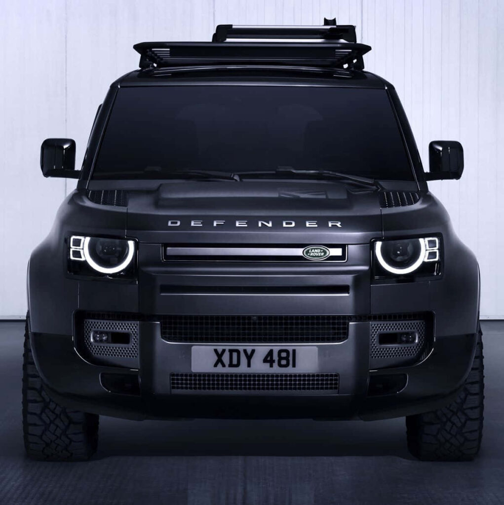 Bold Black Land Rover Defender: Off-Road Mastery Wallpaper Background