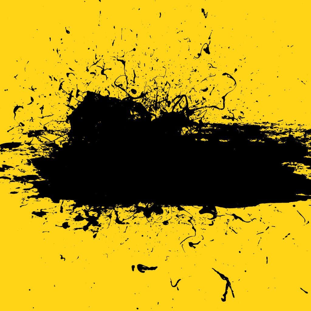 Black paint splatter on vibrant yellow background edgy abstract grunge wallpaper background
