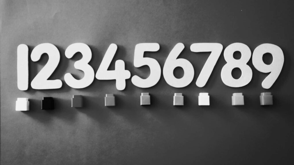 Stylized Black and White Abstract Wallpaper with Bold Numerals 1-9