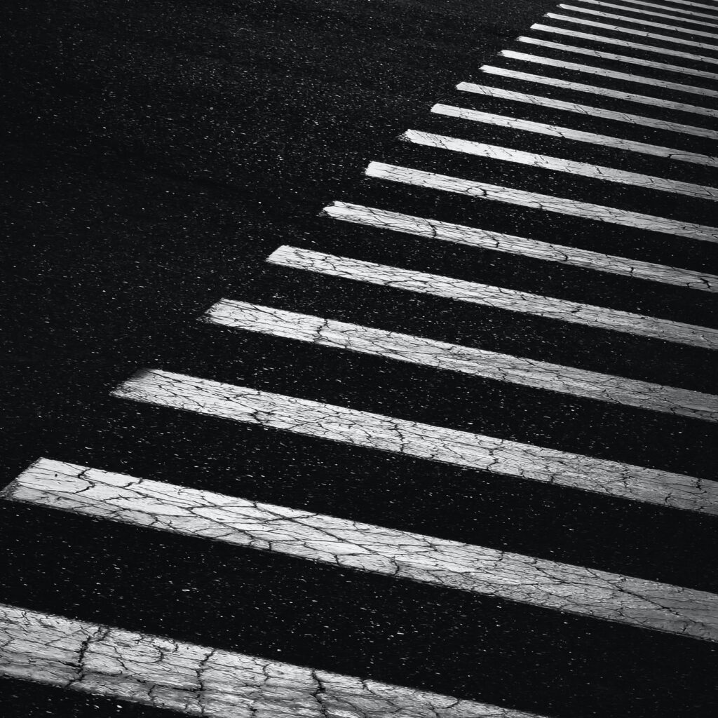 Bold Black and White Paved Surface Wallpaper with Diagonal Stripes