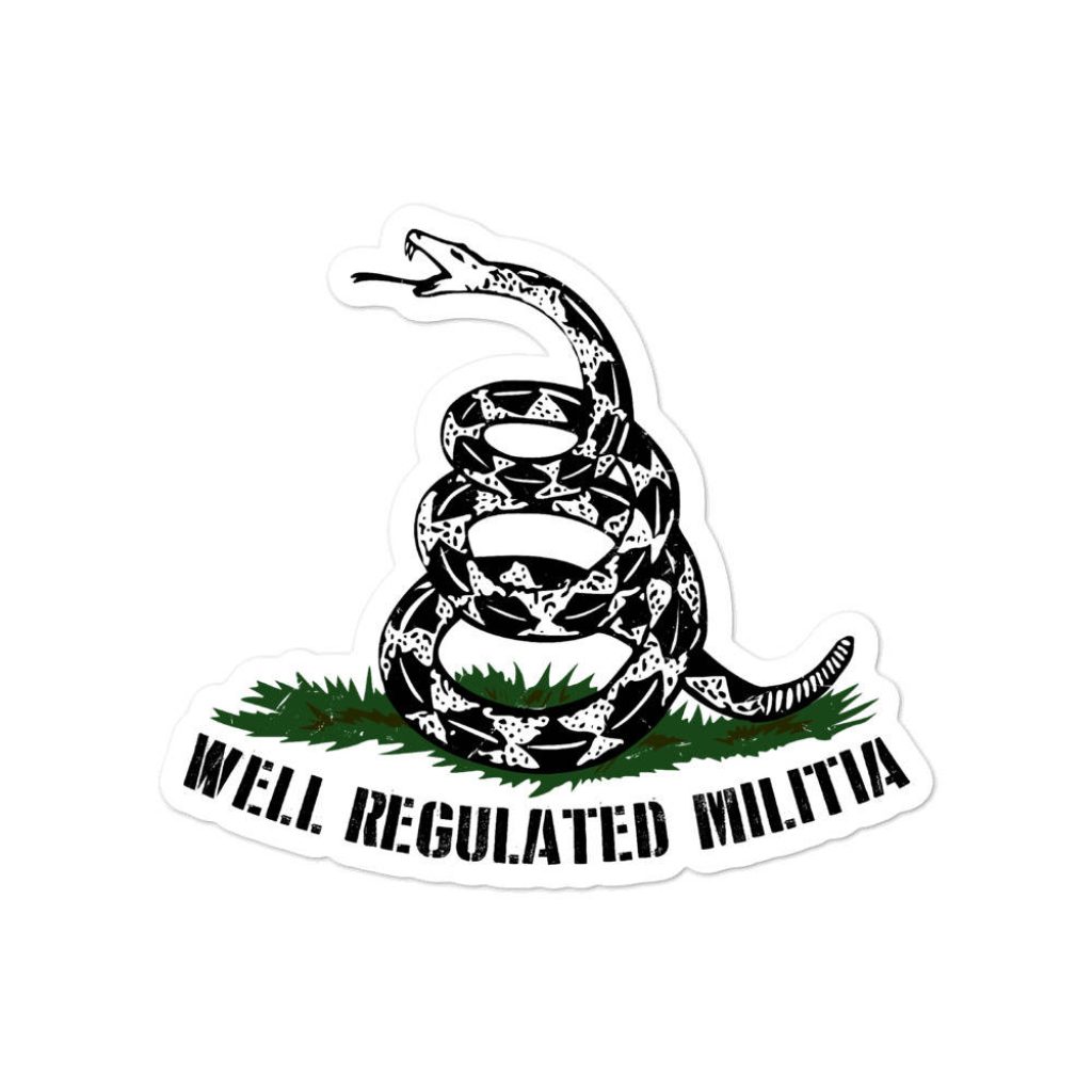 Black and white rattlesnake sticker on grass with well regulated militia text in stencil font Wallpaper
