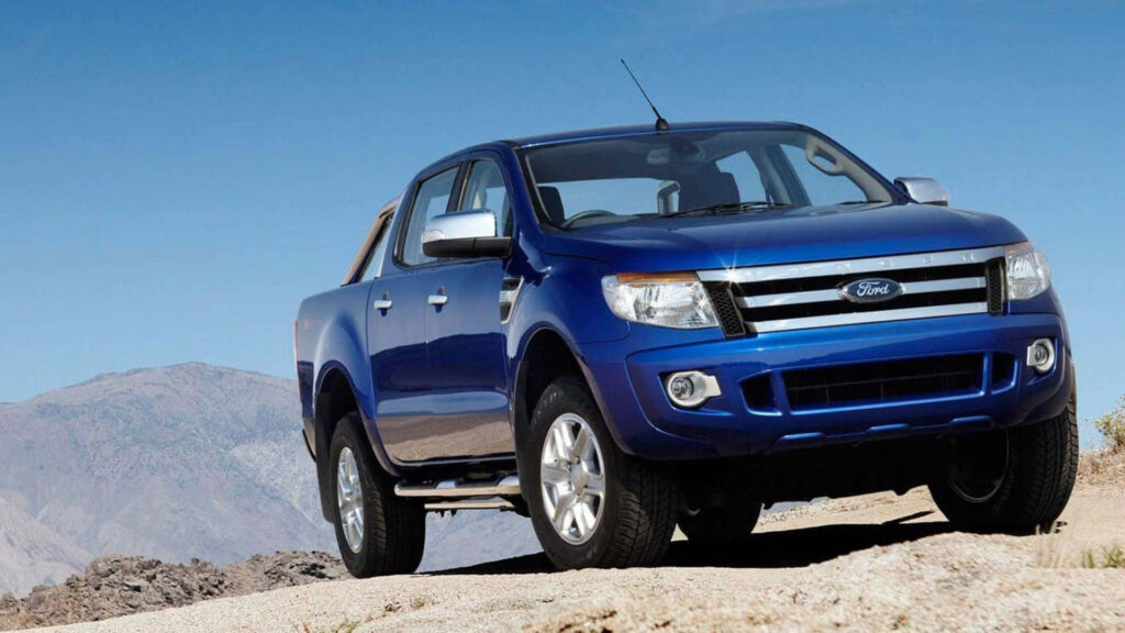 Bold blue Ford Ranger parked in wilderness showcasing rugged adventure and modern style wallpaper