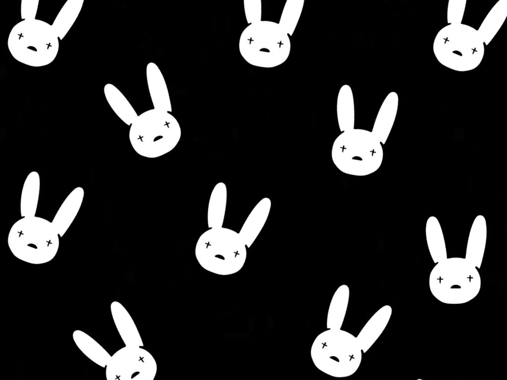 Contrasting Rabbit Designs on a Sleek Black Canvas: An Artwork Befitting Bad Bunny Fans Wallpaper