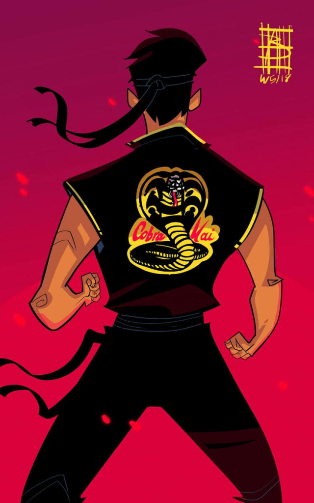 Bold Cobra Kai Phone Wallpaper: Intense Martial Artist on Red Background