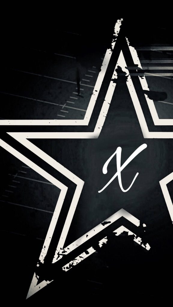 Distressed white star with handwritten cursive X on black background modern edgy wallpaper