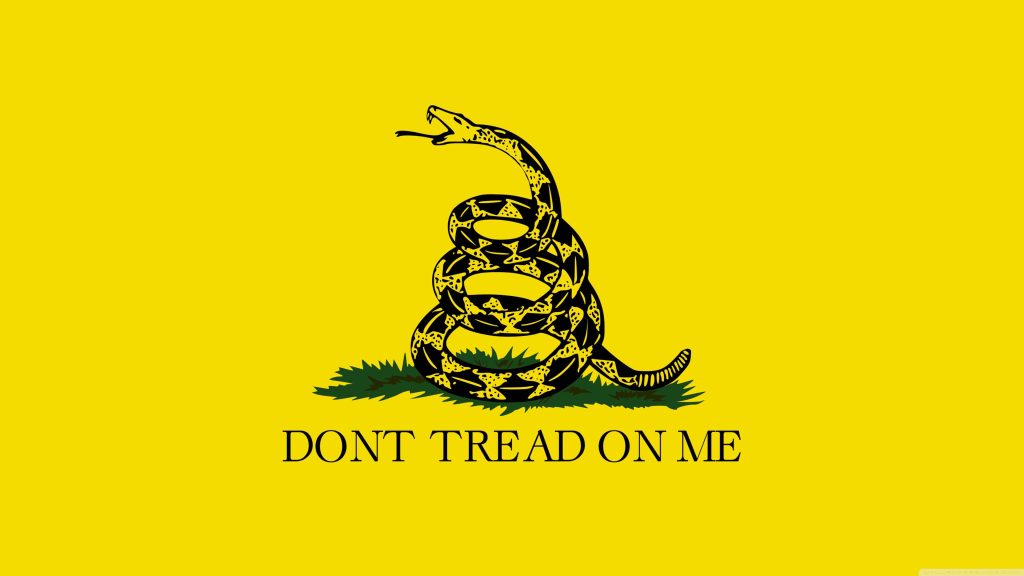 Gadsden Flag wallpaper with coiled rattlesnake and bold Dont Tread On Me text on yellow background