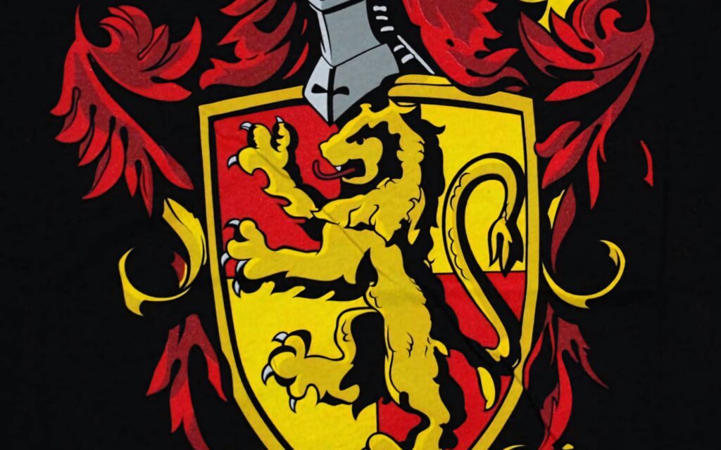 Gryffindor crest with golden lion on red and gold medieval shield ornate foliage wallpaper