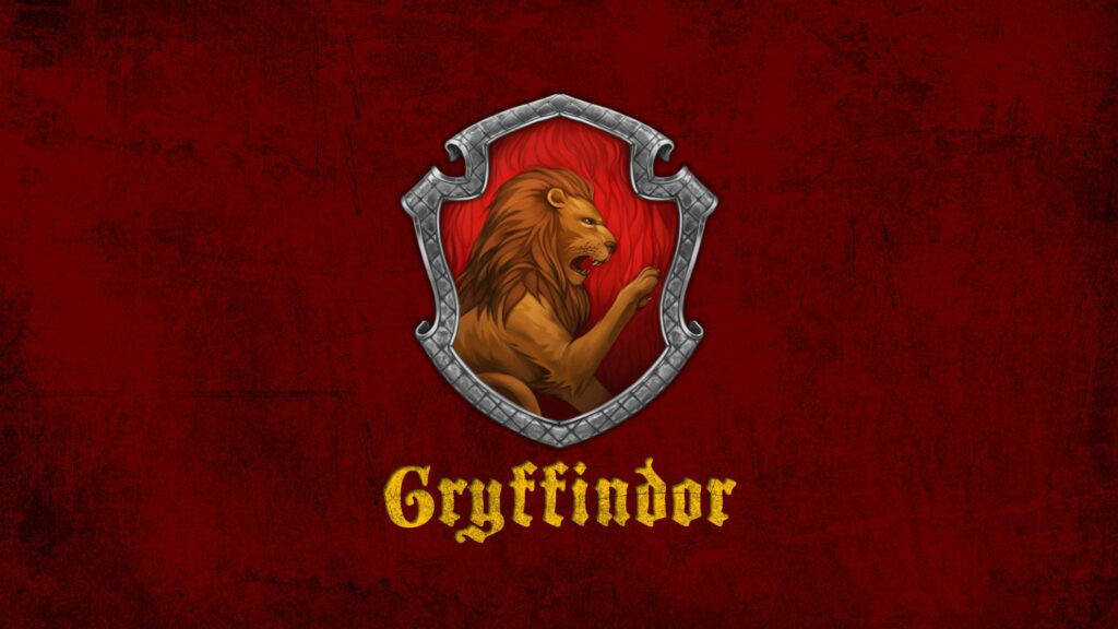 Gryffindor lion emblem on textured red background Harry Potter laptop wallpaper for fans