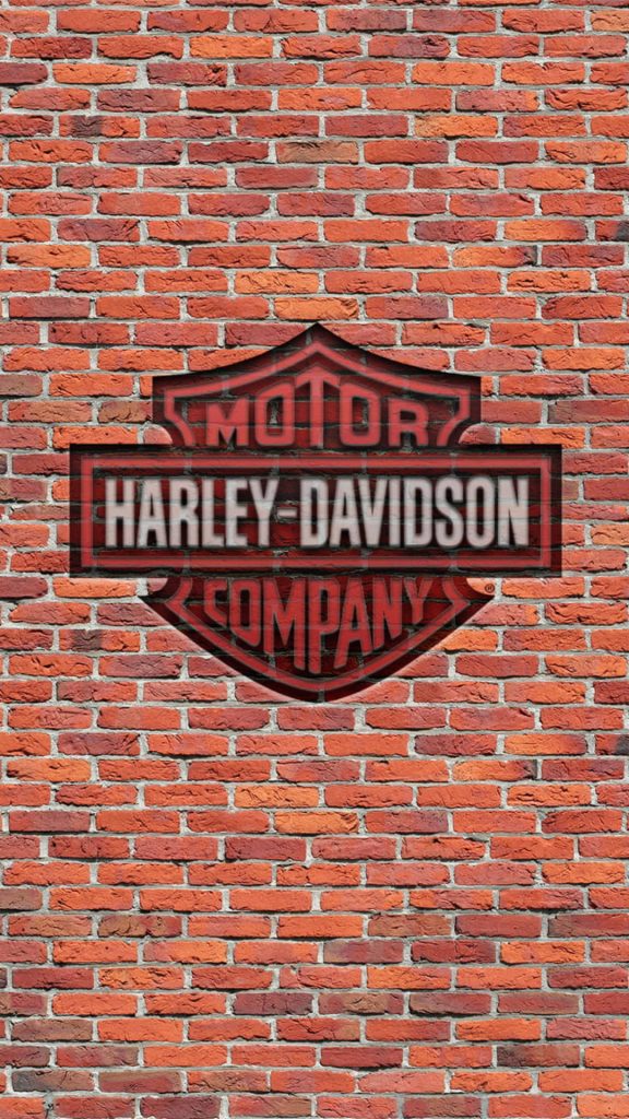 Harley Davidson Bar and Shield logo on weathered red brick wall industrial style wallpaper