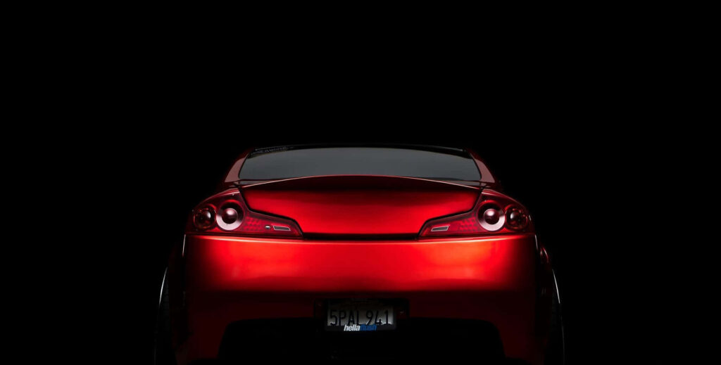 Bold Infiniti G35 Wallpaper: Deep Red on Minimalist Black Background