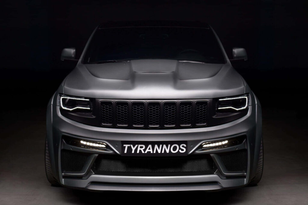 Bold Jeep Grand Cherokee TYRANNOS Wallpaper in Dramatic Setting