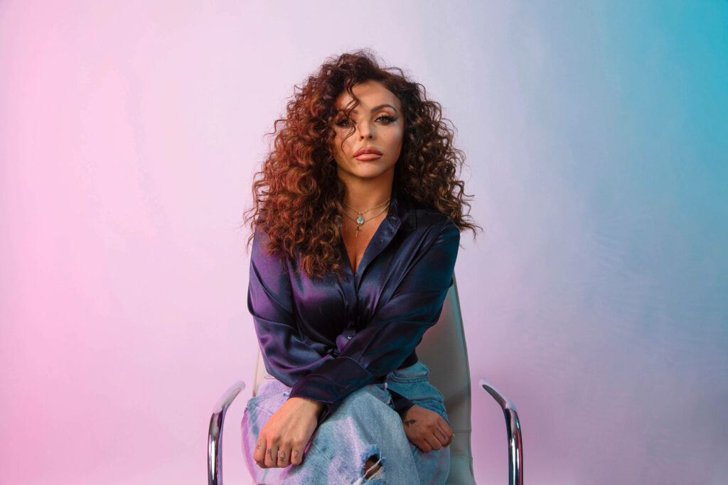 Vibrant Jesy Nelson Wallpaper: Bold Pastel Gradient Background