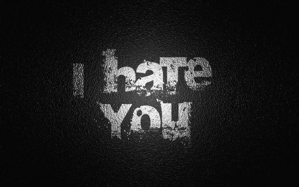 Bold minimalist wallpaper with distressed white I hate You text on dark gritty black background