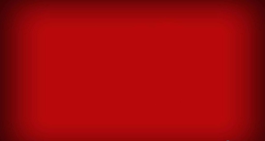 Minimalist vibrant red computer wallpaper with subtle vignette for clean distraction-free background