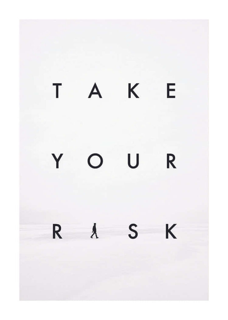 Bold Minimalist Wallpaper: 'TAKE YOUR RISK' in Snowy Landscape