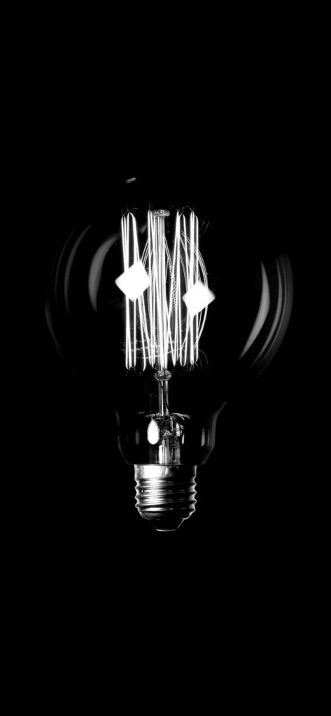 Monochrome Light Bulb Wallpaper: A Bold Symbol of Innovation