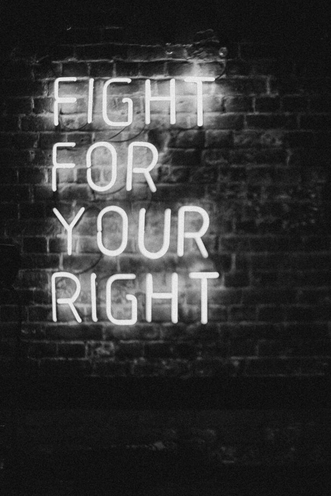 Bold Neon FIGHT FOR YOUR RIGHT Wallpaper on Dark Brick Background