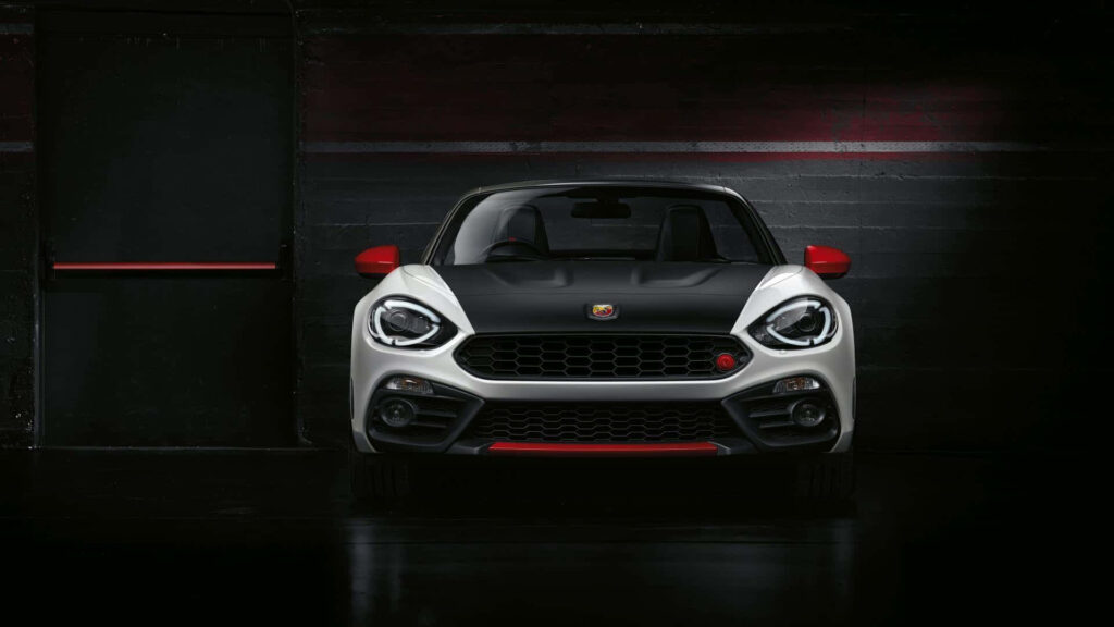 Red and black Abarth sports car with aggressive front design showcasing Italian racing spirit Wallpaper