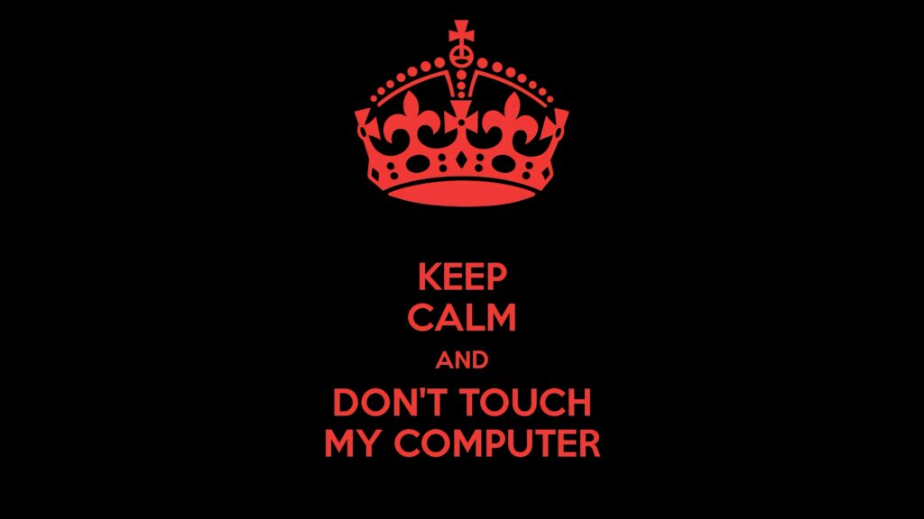Bold red crown with Keep Calm Dont Touch My Computer text on black minimalist wallpaper background