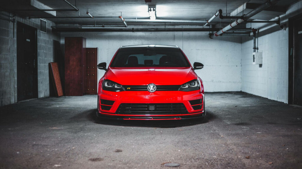 Bold Red VW Golf GTI: Sporty Design in Stunning Garage Wallpaper
