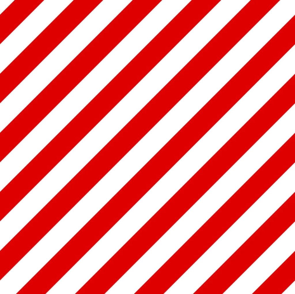 Bold red and white diagonal striped wallpaper with modern high-contrast geometric pattern background